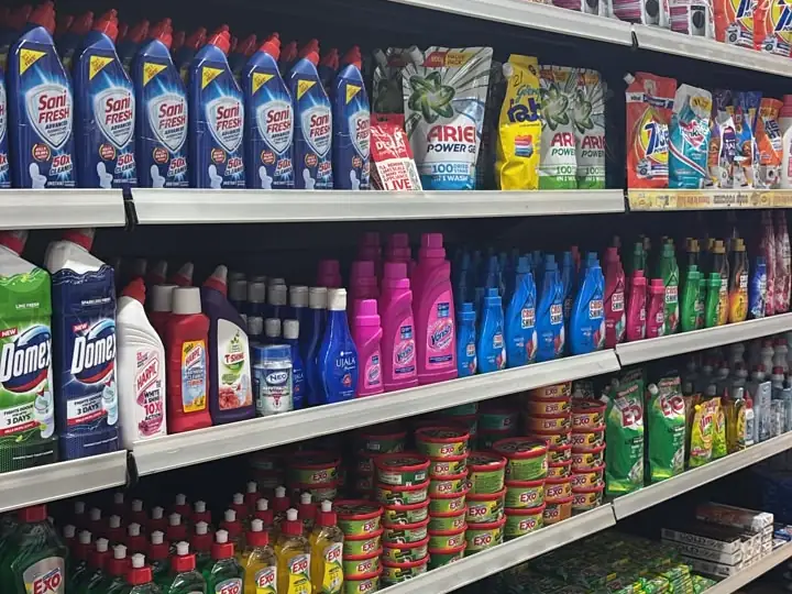 An aisle of Exo dishwash, Sanifresh, Domex and detergent bottles