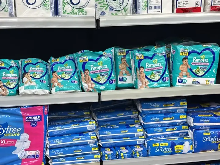 Shelves of Kressa tissues, Pampers diapers and Stayfree pads