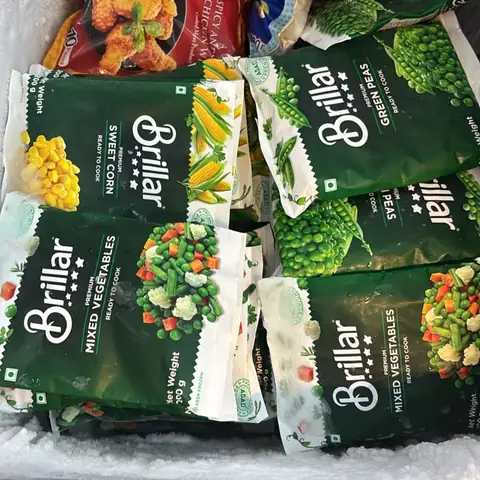 A freezer full of Brillar mixed vegetables and green peas