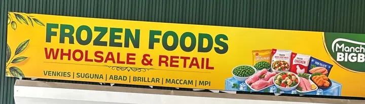 Our yellow signboard: Frozen Foods — Wholesale & Retail. Venkies, Suguna, Abad, Brillar, Maccam, MPI