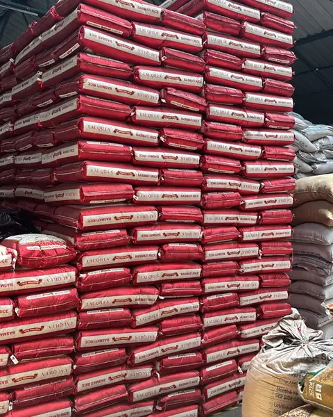 Hundreds of red Lal Qilla basmati sacks stacked in the warehouse