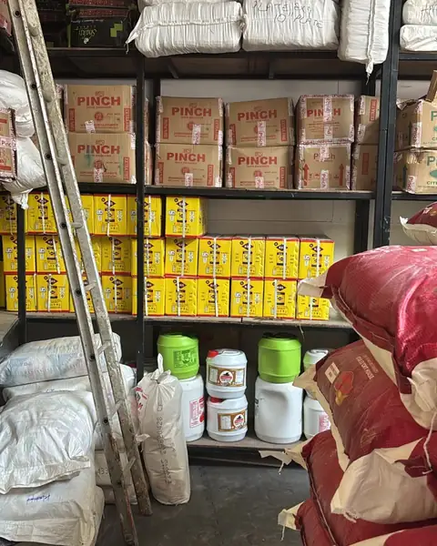 Storeroom racks of Pinch cartons, tins and sacks