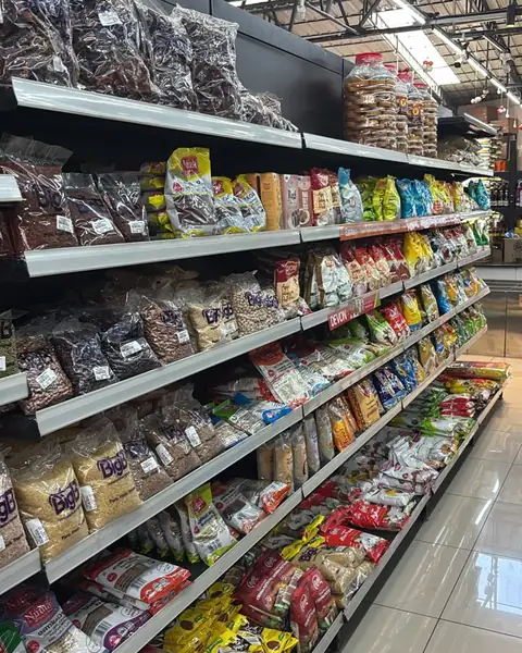 An aisle of packed dry fruits, nuts and snacks