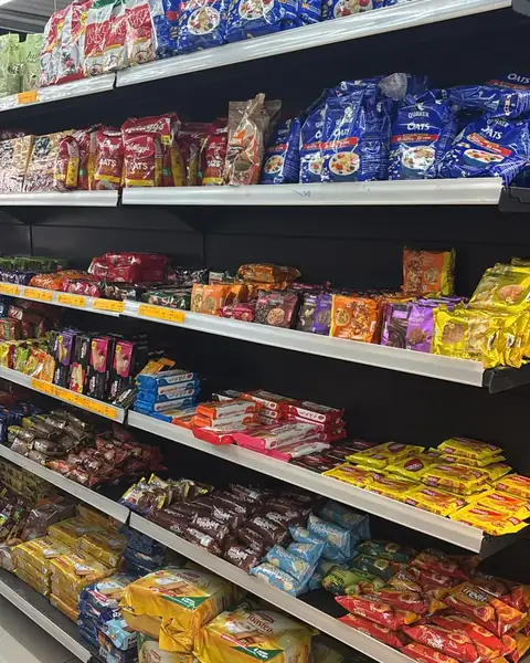 Shelves of breakfast cereals, noodles and packaged foods