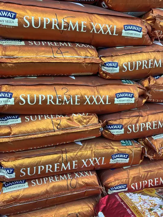 Stacked copper-coloured sacks of Daawat Supreme XXXL basmati rice